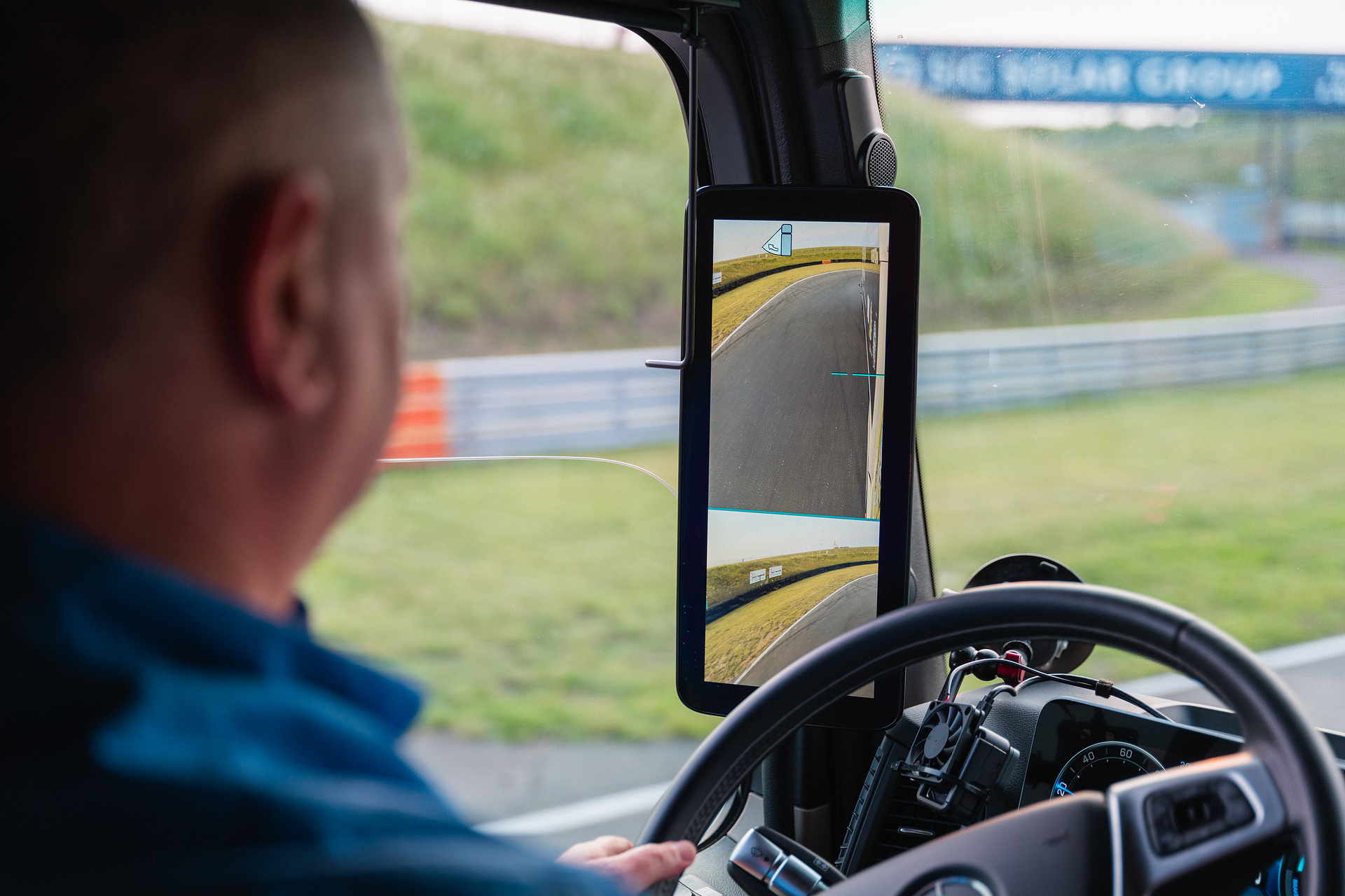 Marco Hellgrewe at the steering wheel of the eActros 600 during the GUINNESS WORLD RECORDS™ reverse drive Mercedes-Benz Trucks wins GUINNESS WORLD RECORDS™ title with eActros 600